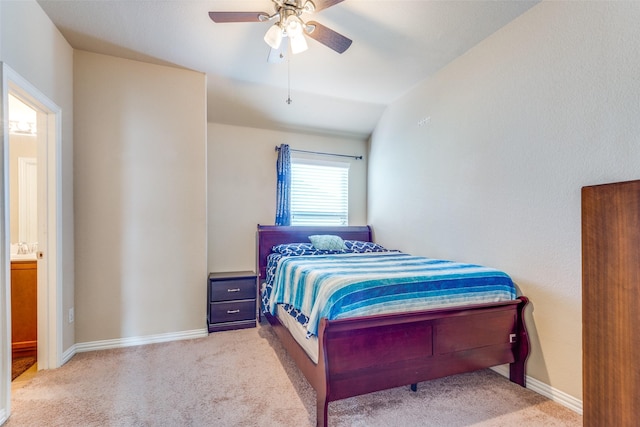 carpeted bedroom featuring connected bathroom, ceiling fan, and lofted ceiling