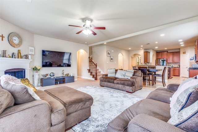 living room featuring ceiling fan and light tile patterned floors