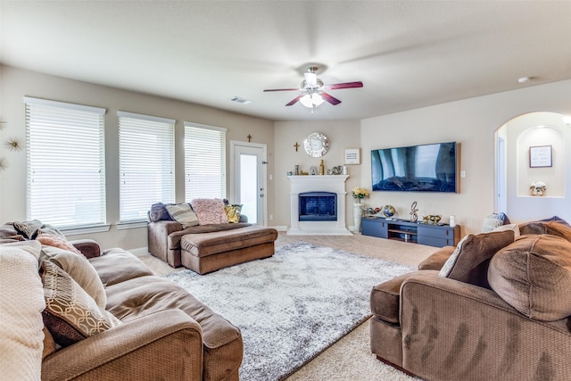 carpeted living room featuring ceiling fan