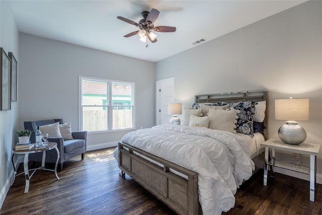 bedroom with dark hardwood / wood-style floors and ceiling fan