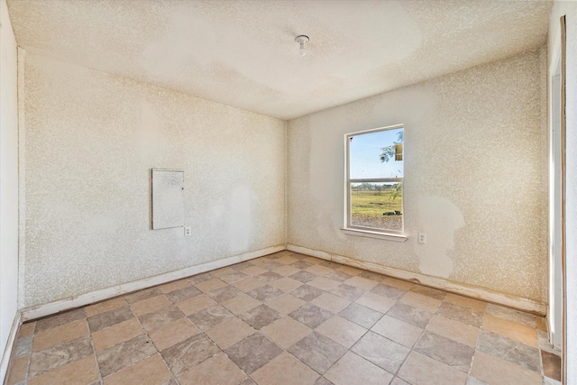 empty room with a textured ceiling