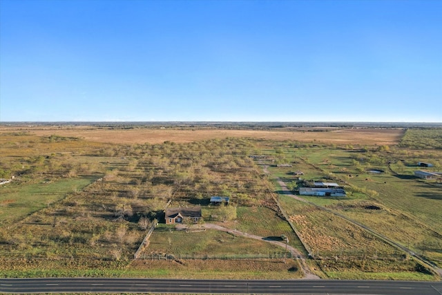 birds eye view of property with a rural view