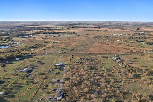 birds eye view of property featuring a rural view