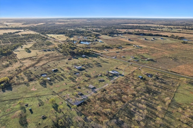 birds eye view of property with a rural view and a water view