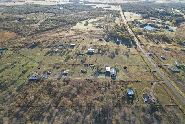 drone / aerial view featuring a rural view and a water view