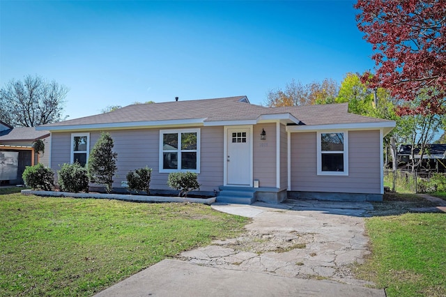 ranch-style house with a front lawn