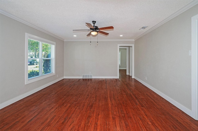 spare room featuring a textured ceiling, hardwood / wood-style flooring, and crown molding