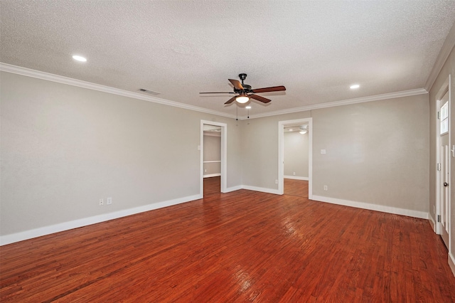 empty room featuring ceiling fan, wood-type flooring, a textured ceiling, and ornamental molding