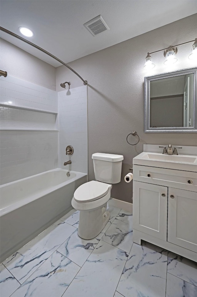 full bathroom featuring vanity, shower / bath combination, and toilet