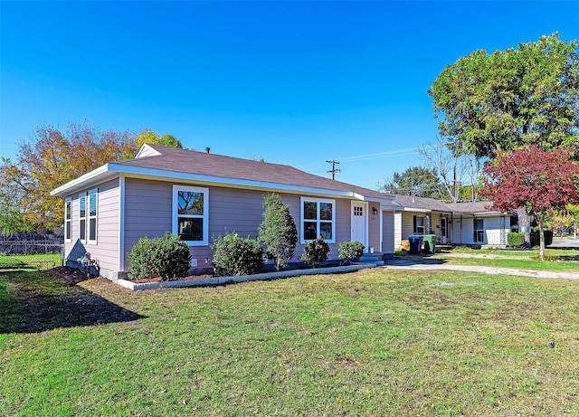 ranch-style home with a front lawn