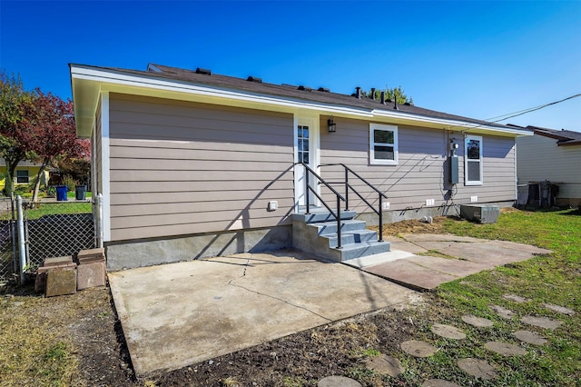 back of property featuring central AC and a patio area