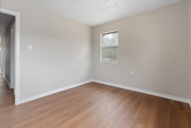 empty room featuring wood-type flooring