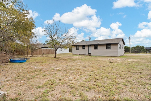 back of house with a yard