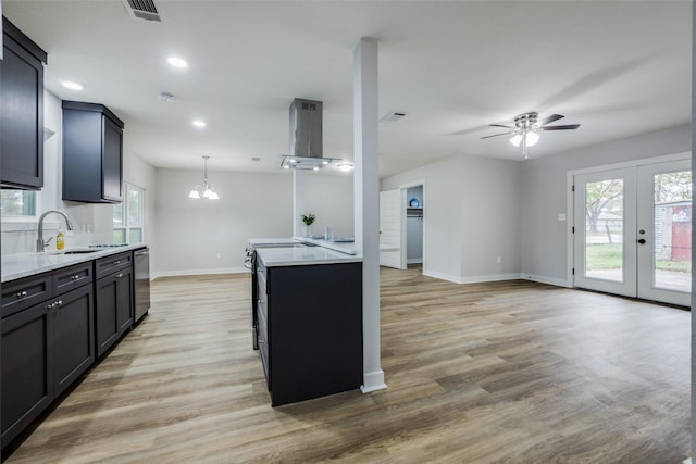 kitchen featuring french doors, island range hood, decorative light fixtures, light hardwood / wood-style flooring, and dishwasher