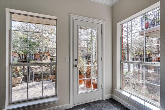 dining room with crown molding, ceiling fan, and light colored carpet