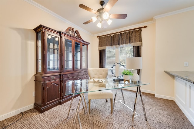 office space featuring crown molding, ceiling fan, and light carpet