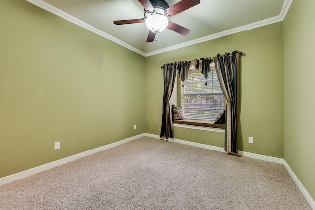 empty room featuring carpet, ceiling fan, and ornamental molding