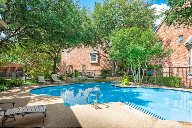 view of pool featuring a patio area