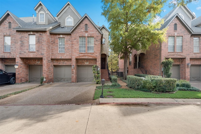 view of front of house featuring central AC unit and a garage