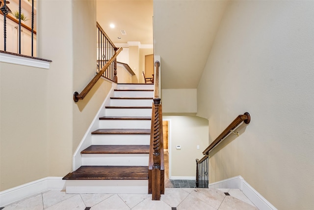 stairs featuring tile patterned flooring