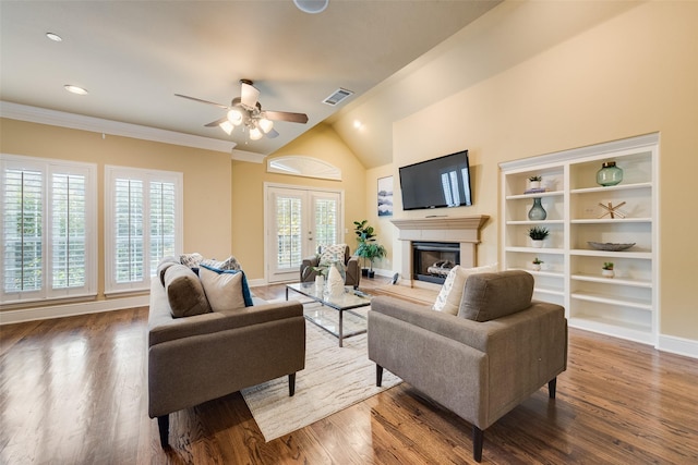 living room featuring ceiling fan, plenty of natural light, hardwood / wood-style floors, and lofted ceiling