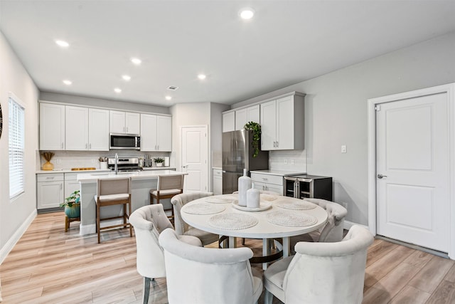 dining room featuring light hardwood / wood-style flooring