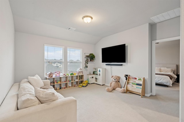 living room featuring carpet floors and vaulted ceiling