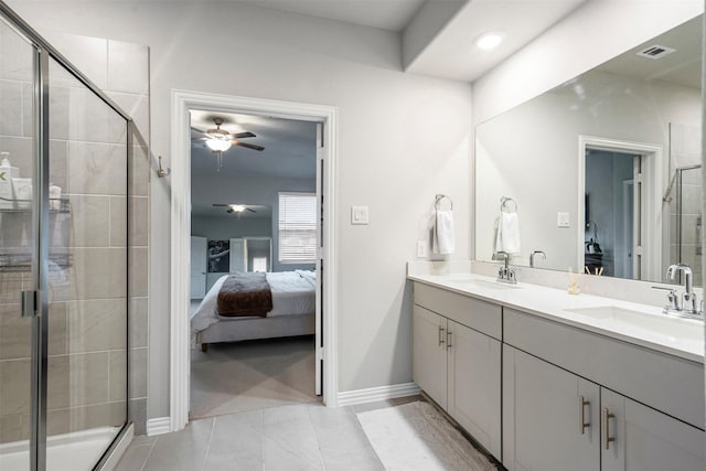 bathroom with ceiling fan, a shower with door, and vanity