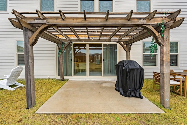 back of house with a pergola, a patio area, and a lawn