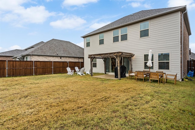 back of property featuring a pergola, a patio area, and a lawn