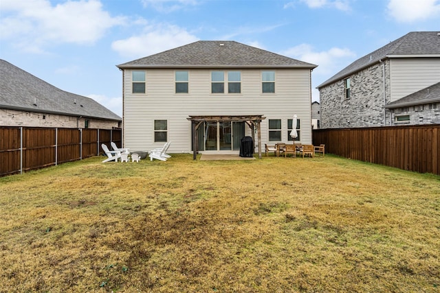 rear view of property with a sunroom and a yard