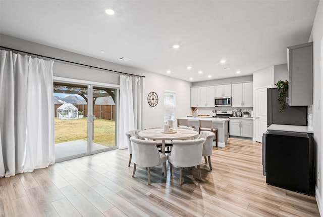 dining space featuring light hardwood / wood-style flooring