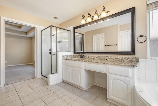 bathroom with tile patterned floors, vanity, and shower with separate bathtub