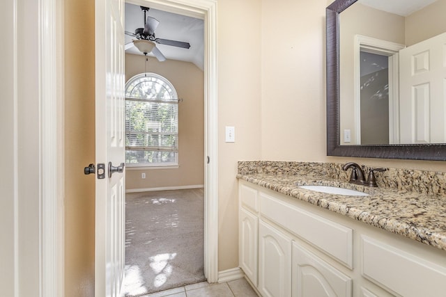 bathroom featuring tile patterned floors, ceiling fan, lofted ceiling, and vanity