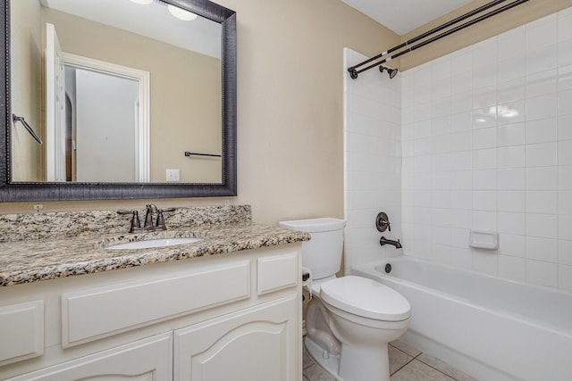 full bathroom with toilet, tile patterned flooring, vanity, and tiled shower / bath