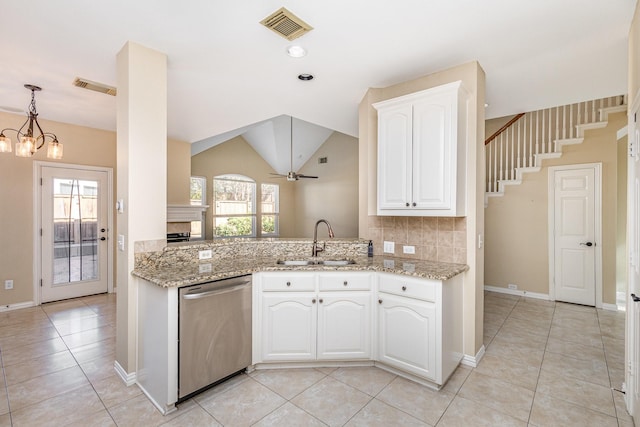 kitchen featuring white cabinets, dishwasher, sink, and ceiling fan with notable chandelier