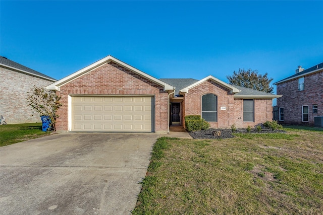 ranch-style home with a garage, central AC unit, and a front yard