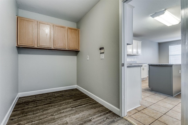 laundry room with light hardwood / wood-style floors