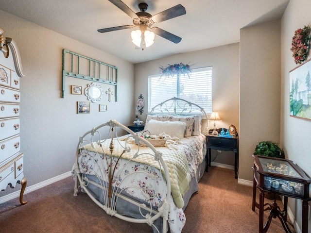 bedroom with ceiling fan and carpet floors