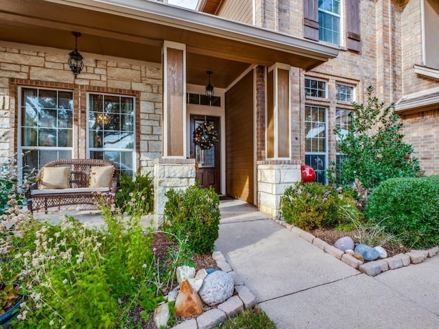 doorway to property featuring a porch