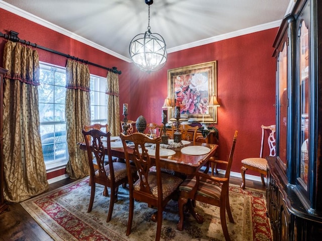 dining space featuring a chandelier, crown molding, and dark wood-type flooring