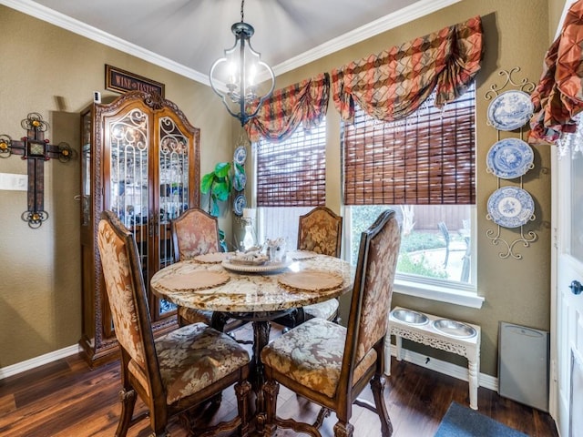 dining area with a chandelier, dark hardwood / wood-style floors, and ornamental molding