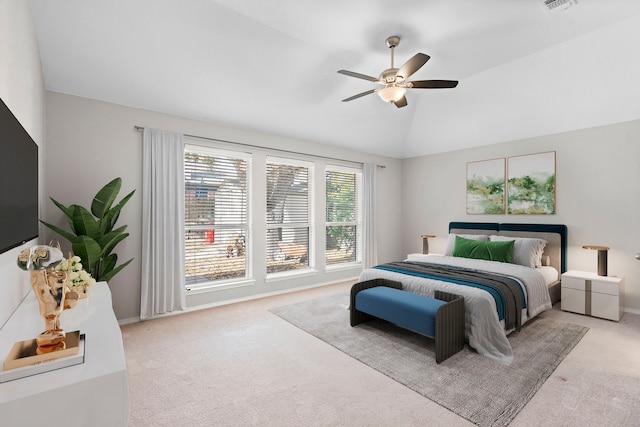 carpeted bedroom featuring ceiling fan and lofted ceiling