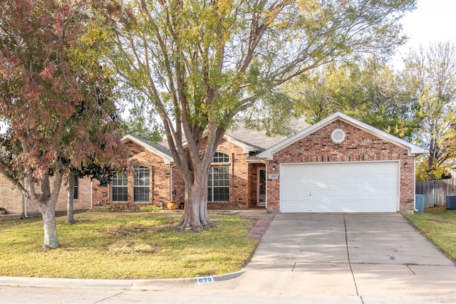 view of front facade with a front yard and a garage