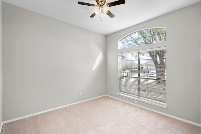 spare room with ceiling fan and carpet floors