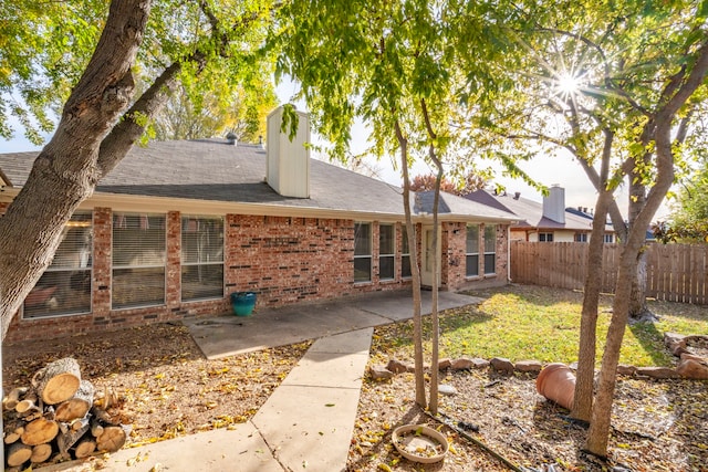 rear view of property with a patio area