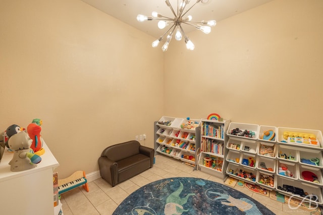 playroom with a chandelier and tile patterned flooring