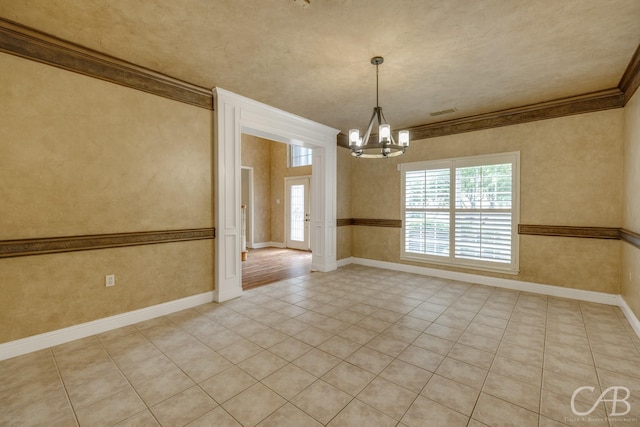 82 Bay Shore Ct, Abilene, TX 79602 - spare room with a chandelier, ornamental molding, baseboards, and light tile patterned floors