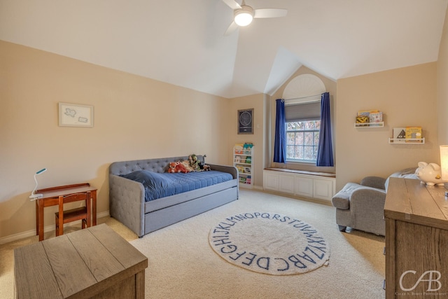 bedroom with light colored carpet, vaulted ceiling, and ceiling fan