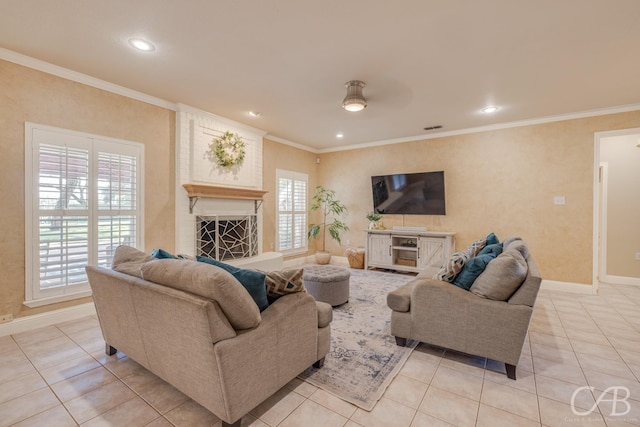 living room with crown molding, plenty of natural light, and ceiling fan